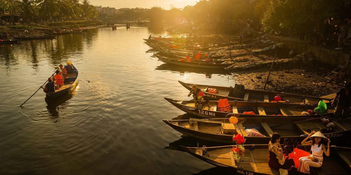 Wooden boats on the river at sunset in Hoi An, Vietnam